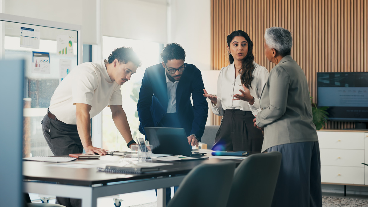 Meeting, AI leaders and business people in office with documents for financial review, feedback and profit. Planning, teamwork and workers with graphs, discussion and research for analysis or growth